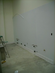 Warehouse wall, with FRP.  Sinks for the brewhouse will be mounted here soon.