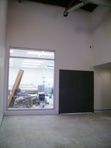 The window and doors into the brewhouse are installed.