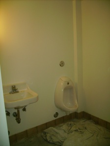 And the men's restroom, with no tile yet...but indoor plumbing that works!  Very exciting indeed!