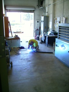 Our friend JT works on welding a support to hold the back-bar.